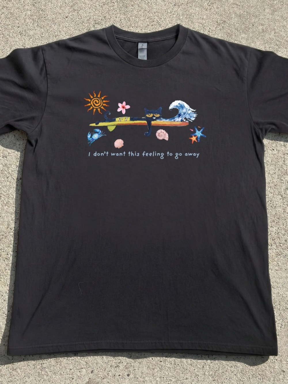 Black Graphic Tee with Surf Cat and Beach Motifs